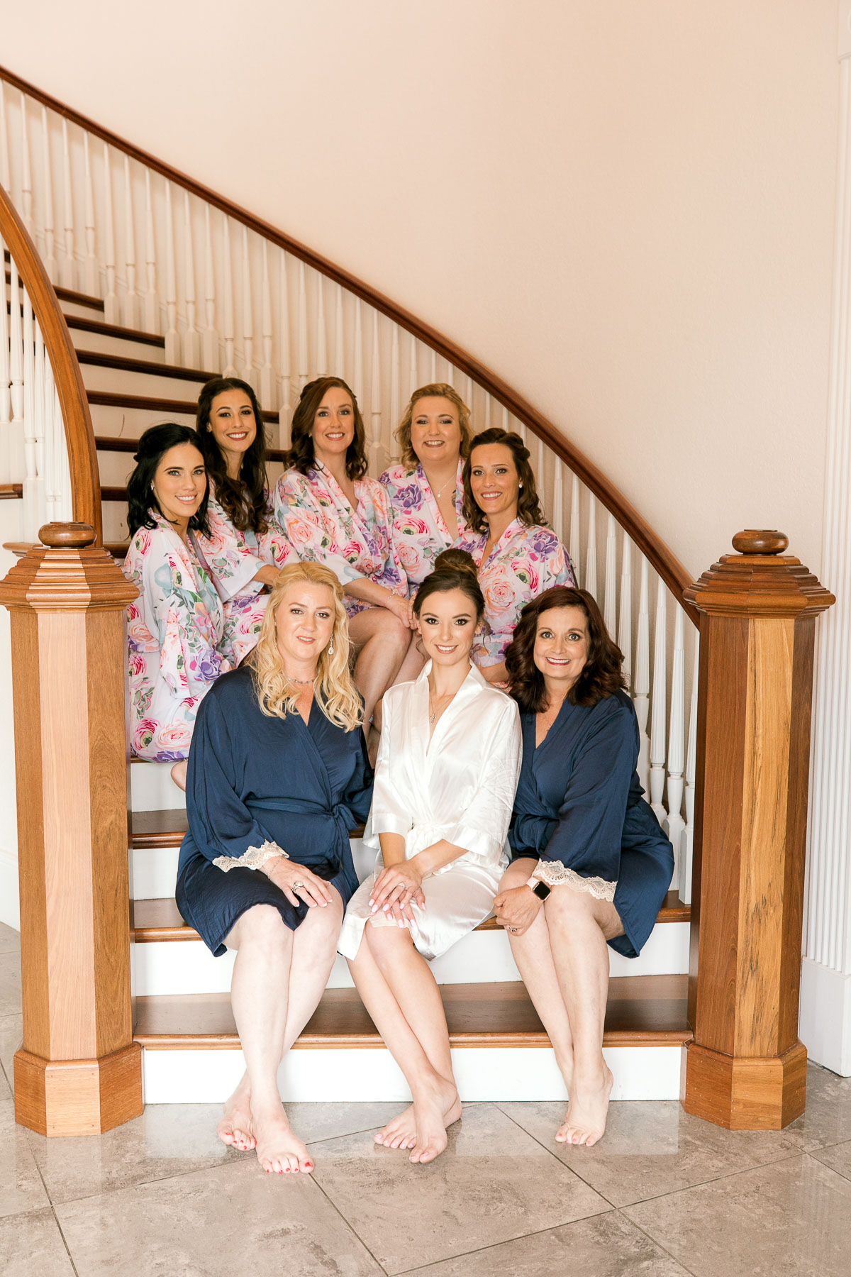 Bride with bridal party on the steps of grand staircase