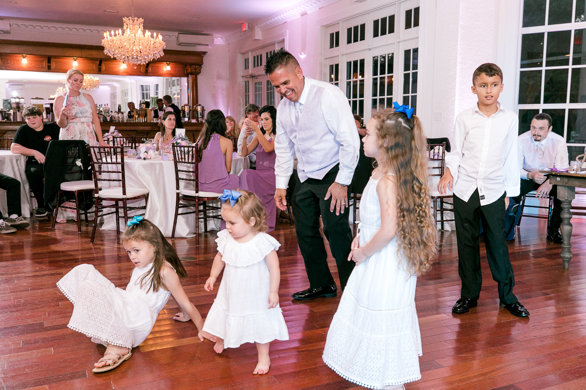 Kids dancing at summer wedding 