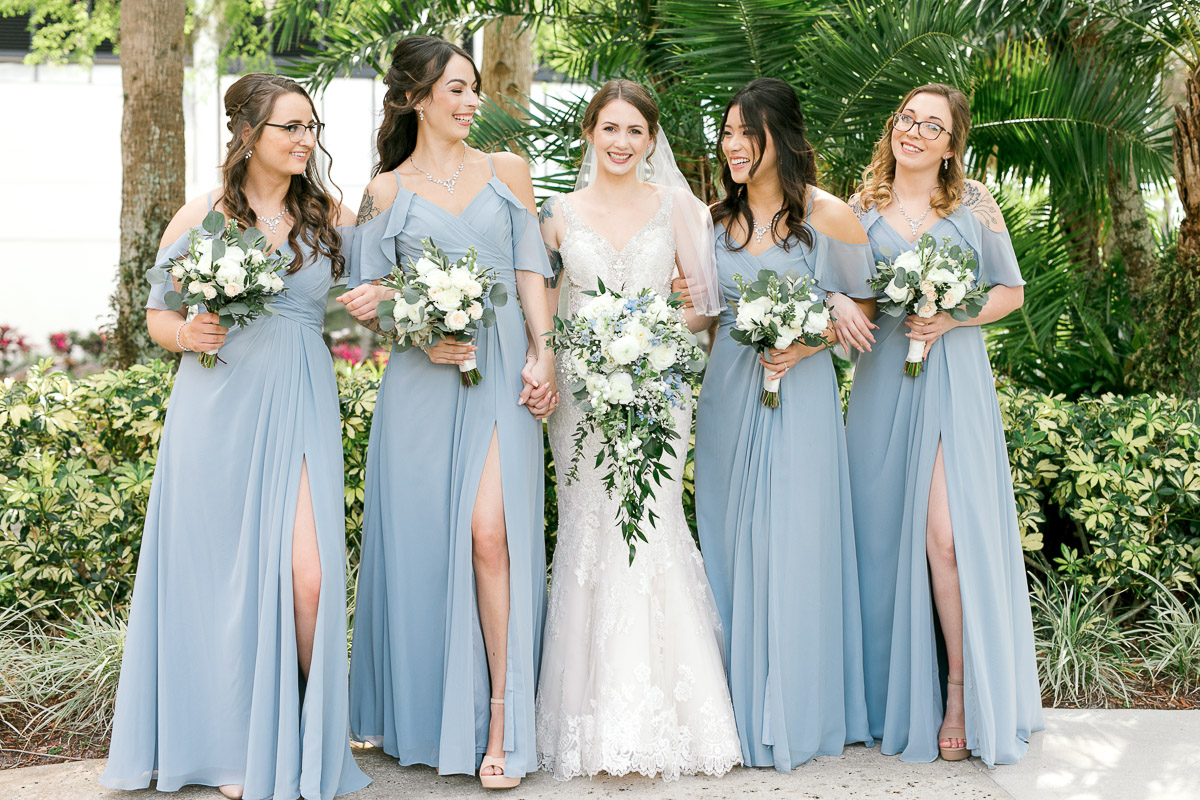 Bride with her bridesmaids in blue dresses