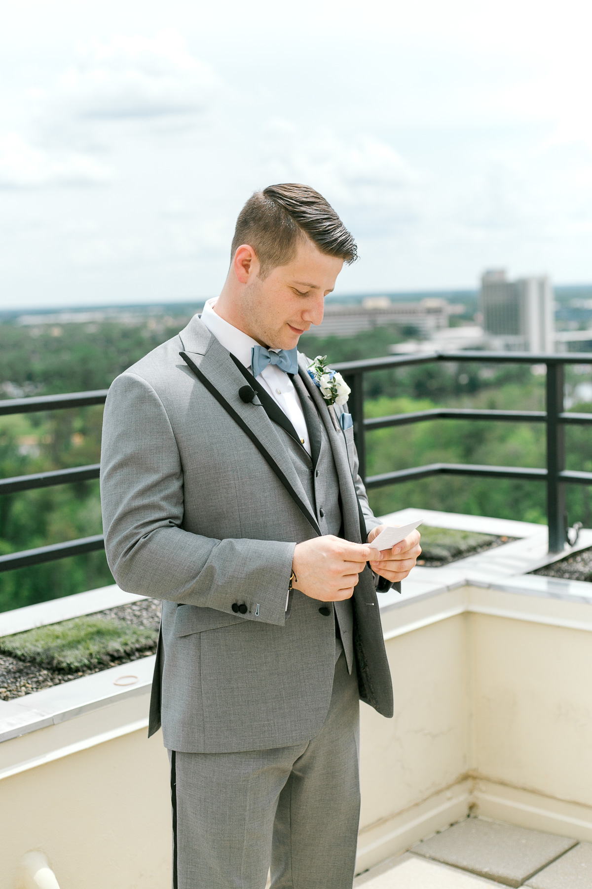 Groom reading note from bride