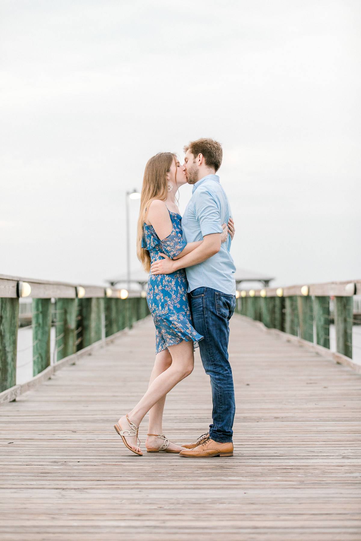 Couple kissing on the dock at Melbourne Beach, FL